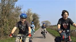 Sam and Zac riding with the group on Long Moor Drove